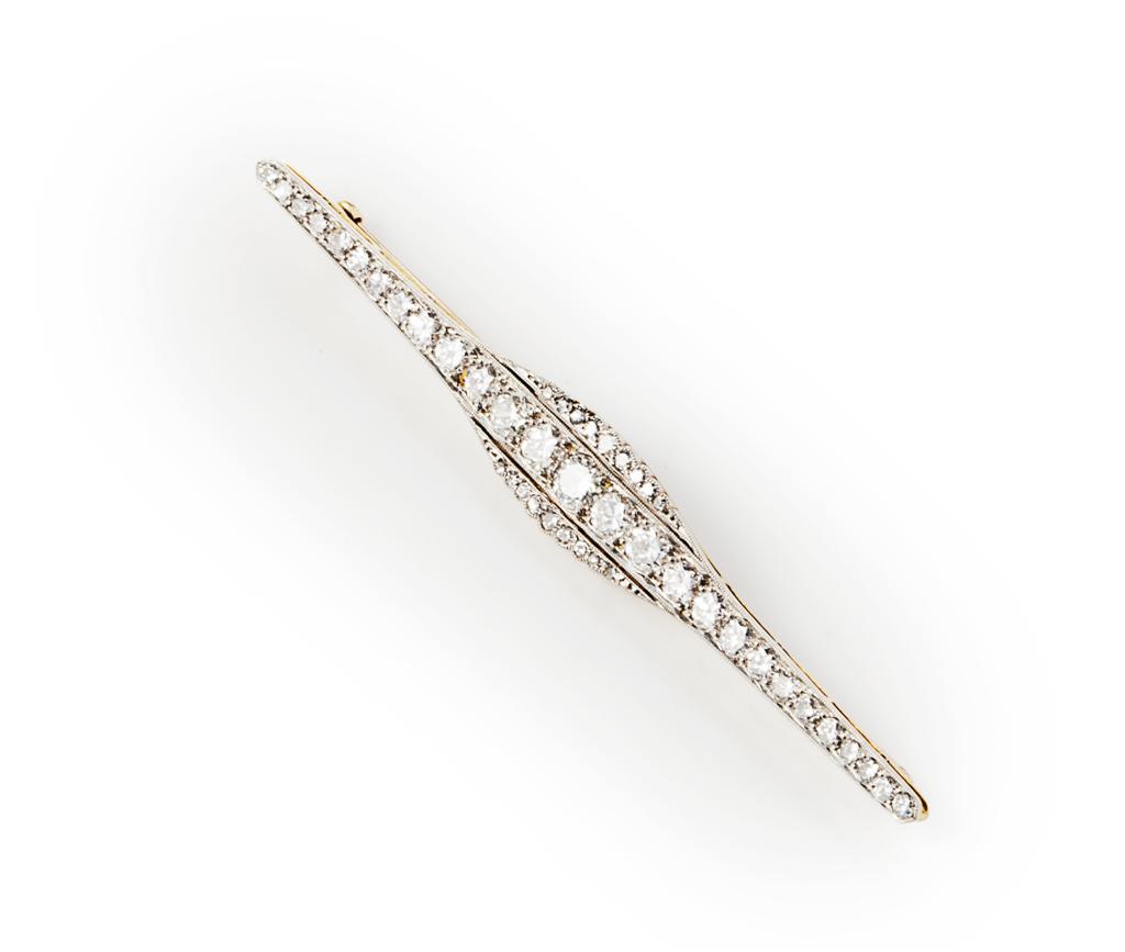 Appraisal: A diamond set bar brooch millegrain set in white metal