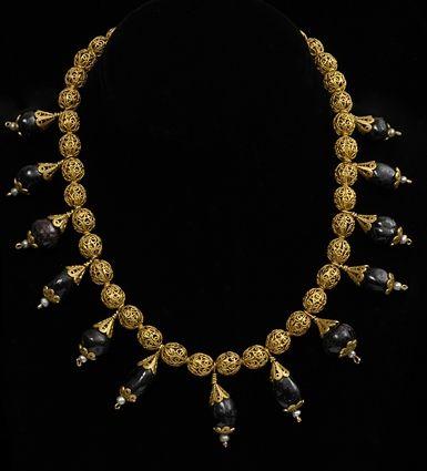 Appraisal: PERSIAN GOLD FILIGREE BEAD NECKLACE WITH GARNET AND PEARL DROPS