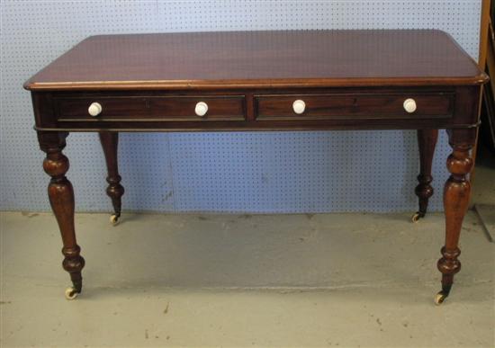 Appraisal: Victorian mahogany writing desk on turned baluster legs with two