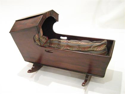 Appraisal: Mahogany bonnet top cradle mid th century With canted hood