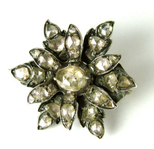 Appraisal: A Victorian diamond flower brooch The white metal setting with