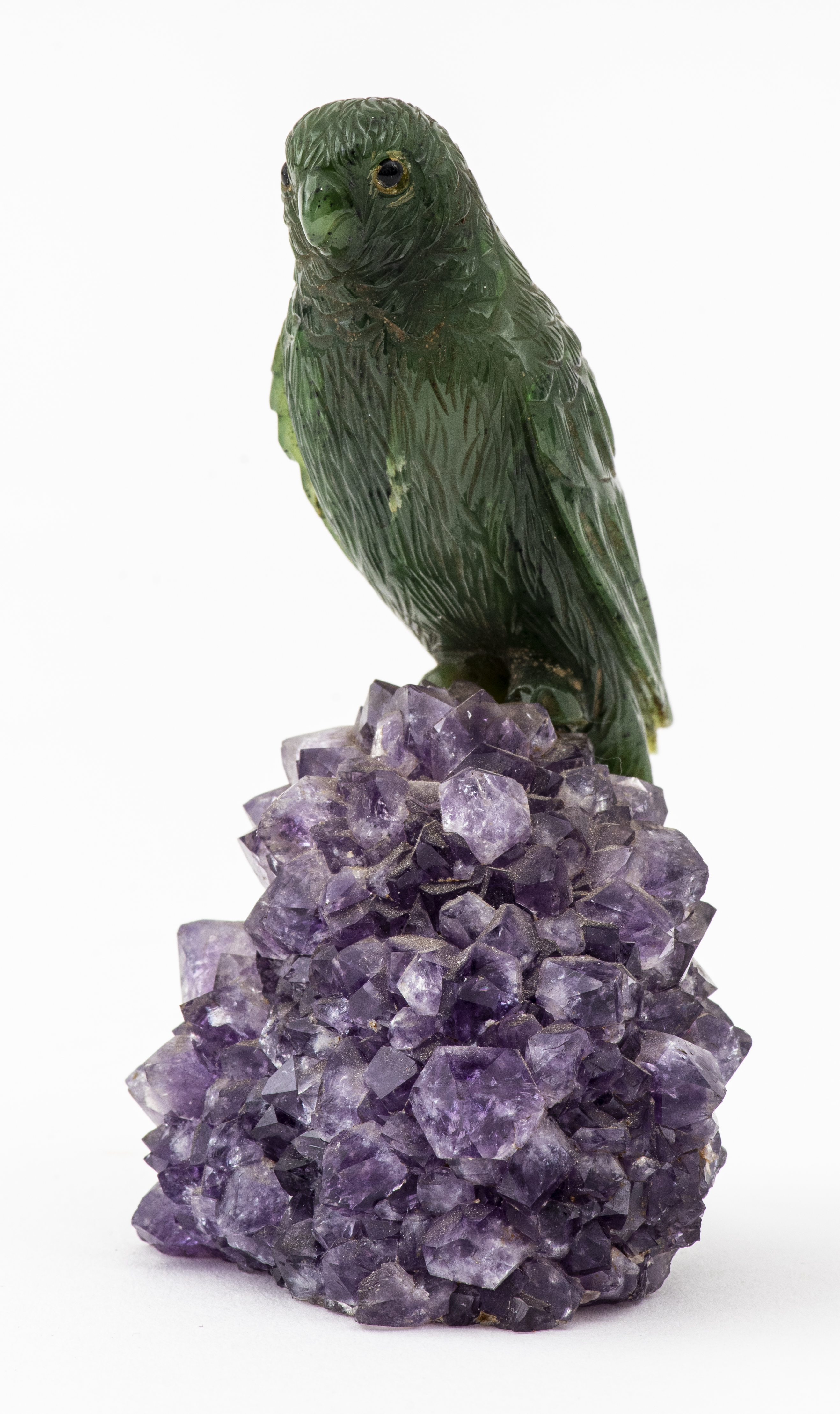 Appraisal: GREEN AGATE BIRD ON PURPLE QUARTZ GEODE Green agate carved