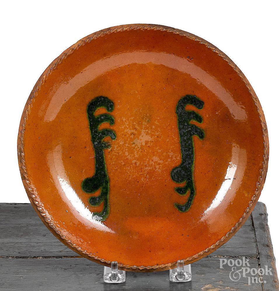 Appraisal: Pennsylvania redware plate Pennsylvania redware plate th c with green