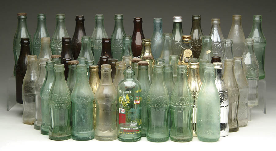 Appraisal: LOT OF APPROX COCA-COLA BOTTLES Includes nine amber and nine