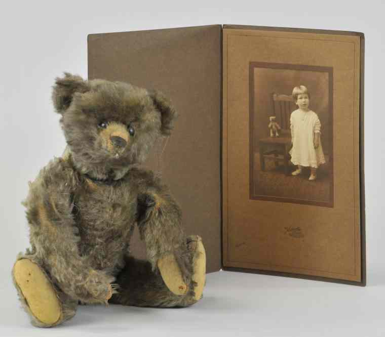 Appraisal: STEIFF TEDDY BEAR WITH PHOTO Adorable brown Steiff teddy with