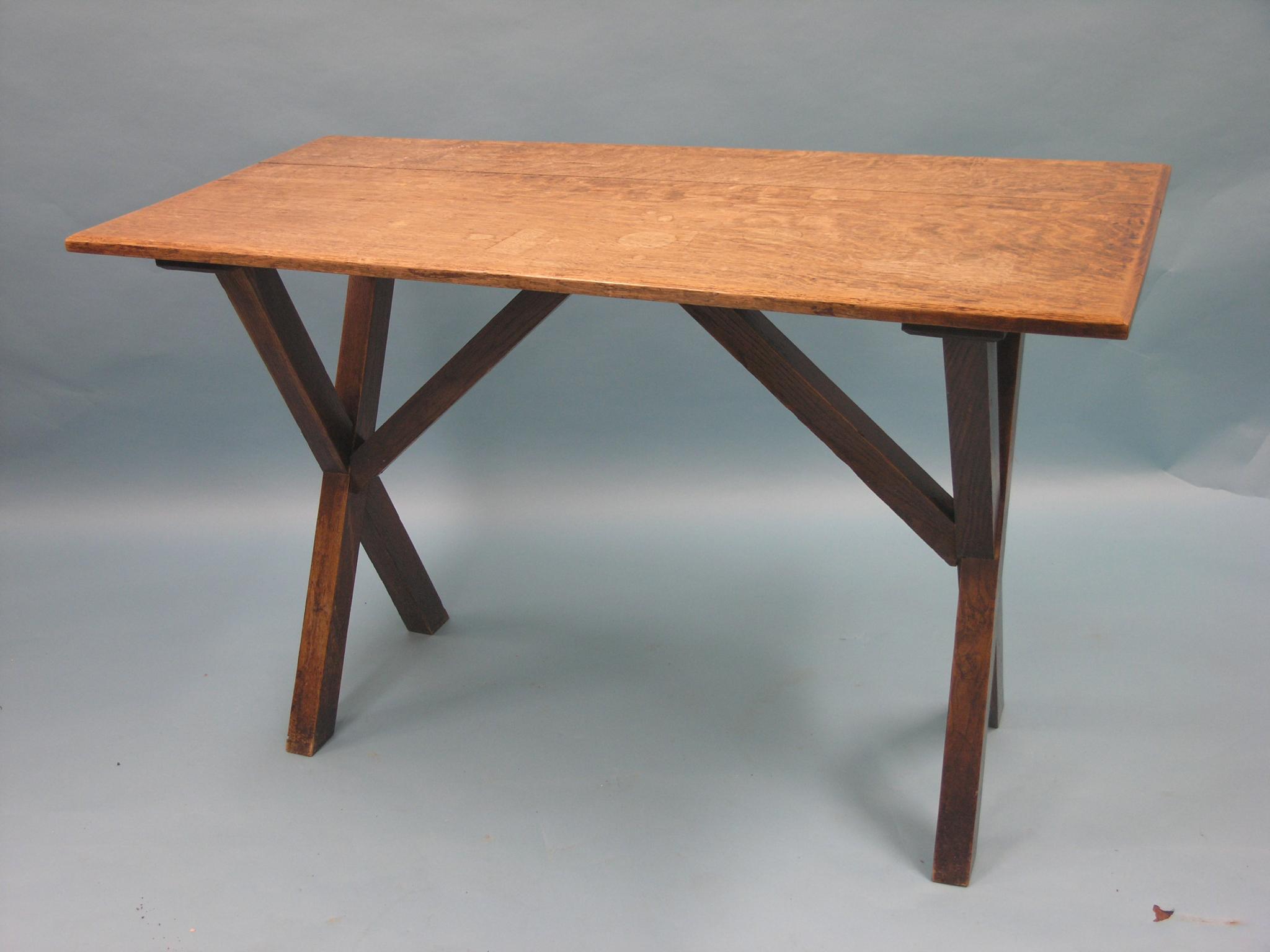 Appraisal: A solid oak kitchen table on X-form end supports ft