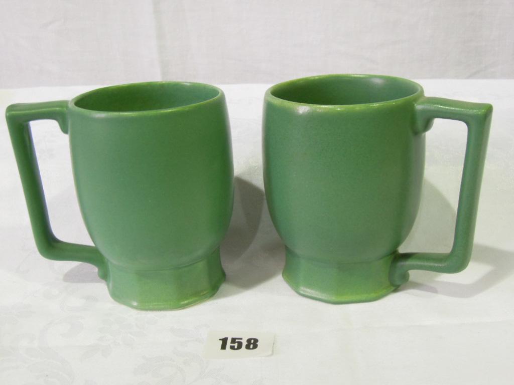 Appraisal: A pair of Wedgwood green glazed mugs designed by Keith