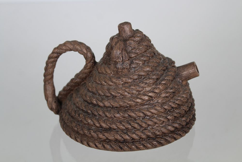 Appraisal: Zhou Dingfang Coiled Rope Yixing Teapot Signed Yixing Clay Coiled