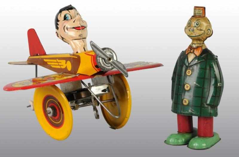 Appraisal: Lot of Tin Character Wind-Up Toys Description American Working Includes