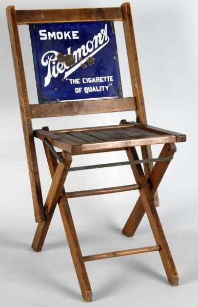 Appraisal: Piedmont Cigarettes Folding Chair Description Four large areas of porcelain