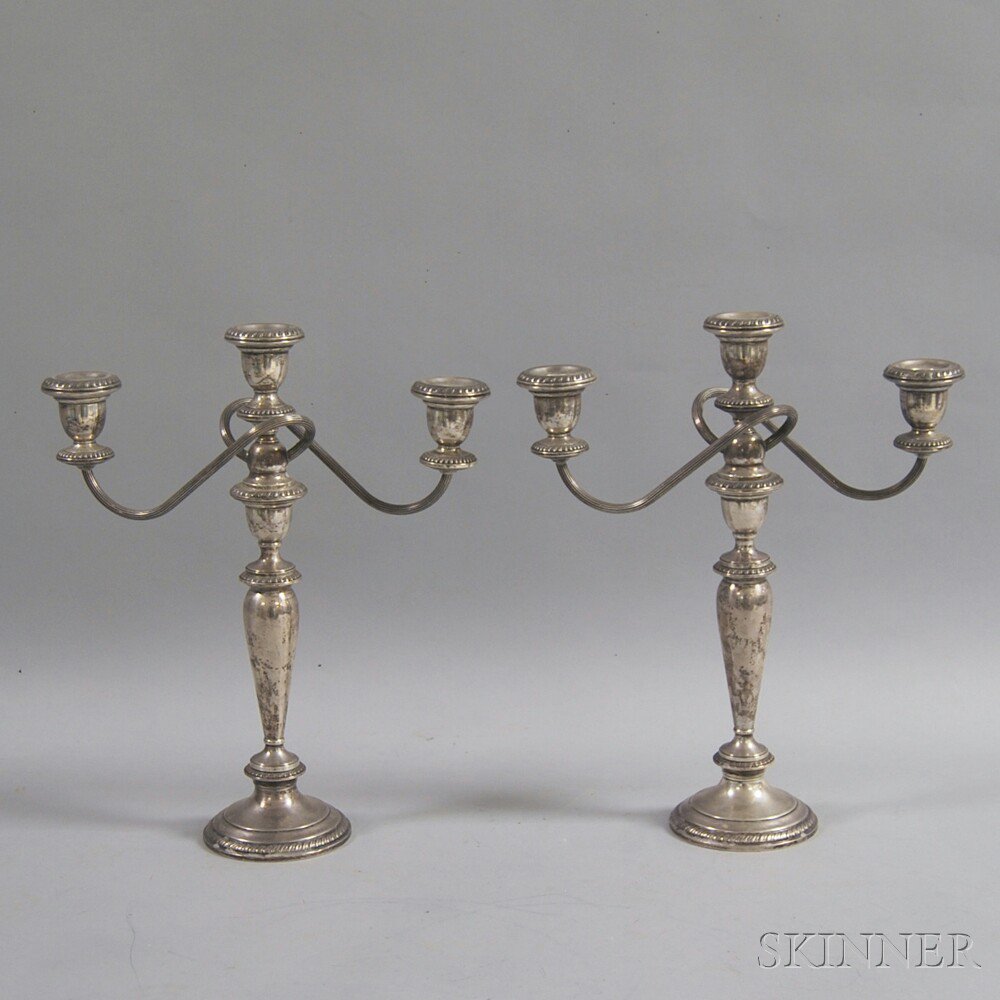 Appraisal: Pair of Poole Weighted Sterling Silver Convertible Three-light Candelabra with