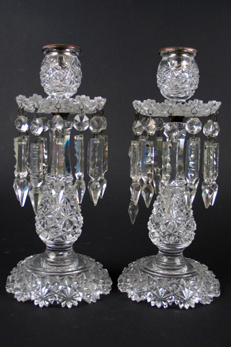 Appraisal: A PAIR OF AMERICAN CUT CRYSTAL CANDLESTICKS having crystal prisms