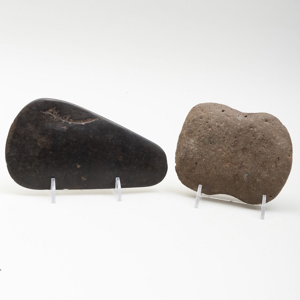 Appraisal: Two Neolithic Carved Stone Axe Heads The larger x in