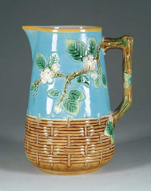 Appraisal: MAJOLICA PITCHER WITH TREE BLOSSOMS Basketry base with upper section