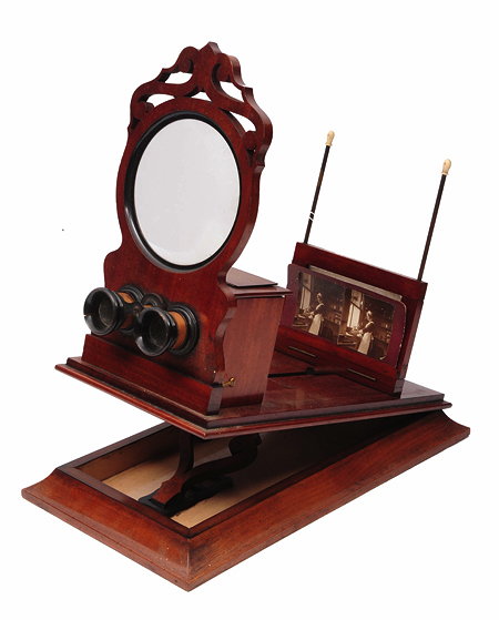 Appraisal: A FRENCH MAHOGANY STEREOSCOPIC AND POSTCARD VIEWER the hinged plinth