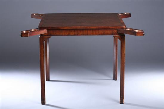 Appraisal: MODERN LEATHER-TOP MAHOGANY CARD TABLE th century Inset tooled leather