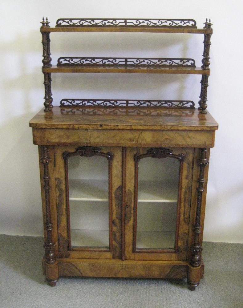 Appraisal: A VICTORIAN WALNUT CHIFFONIER of shallow rounded oblong form the