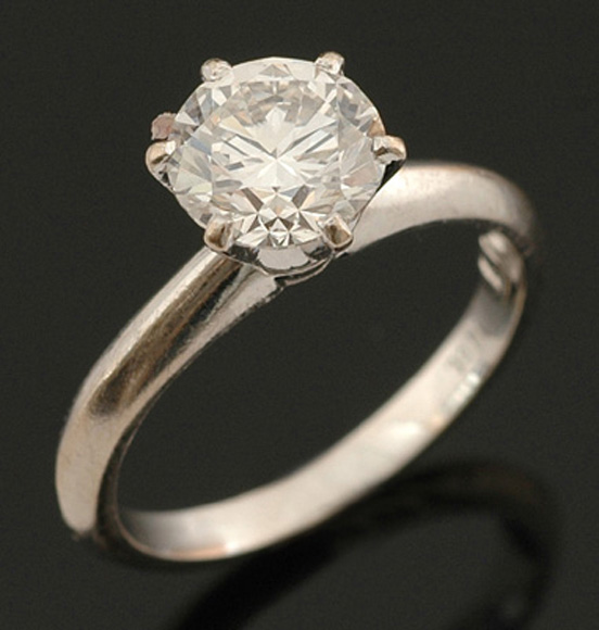 Appraisal: A solitaire diamond ring The round brilliant cut diamond weighing