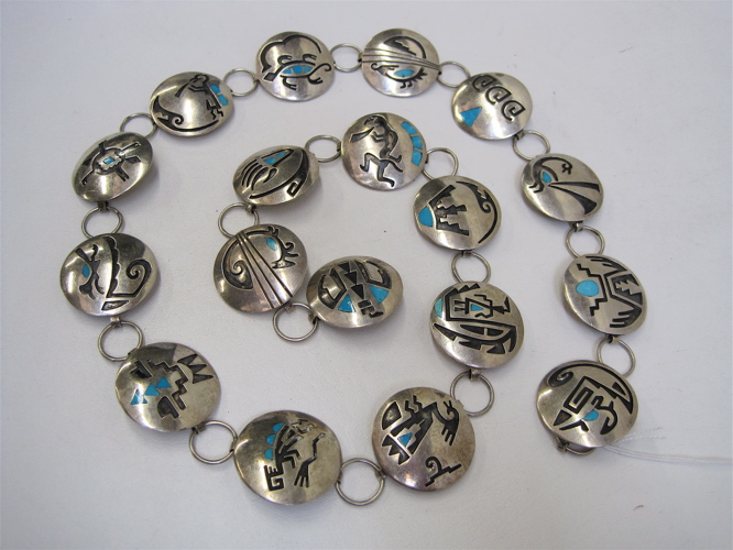 Appraisal: SIGNED NAVAJO SILVER AND TURQUOISE CONCHO BELT in a traditional