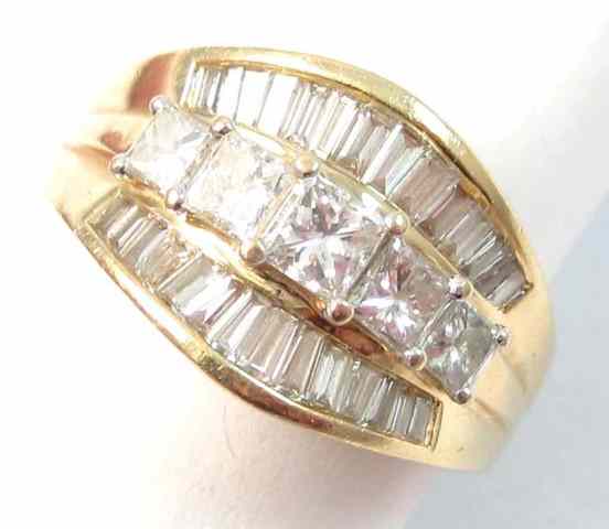 Appraisal: DIAMOND AND FOURTEEN KARAT GOLD RING five princess-cut diamonds are