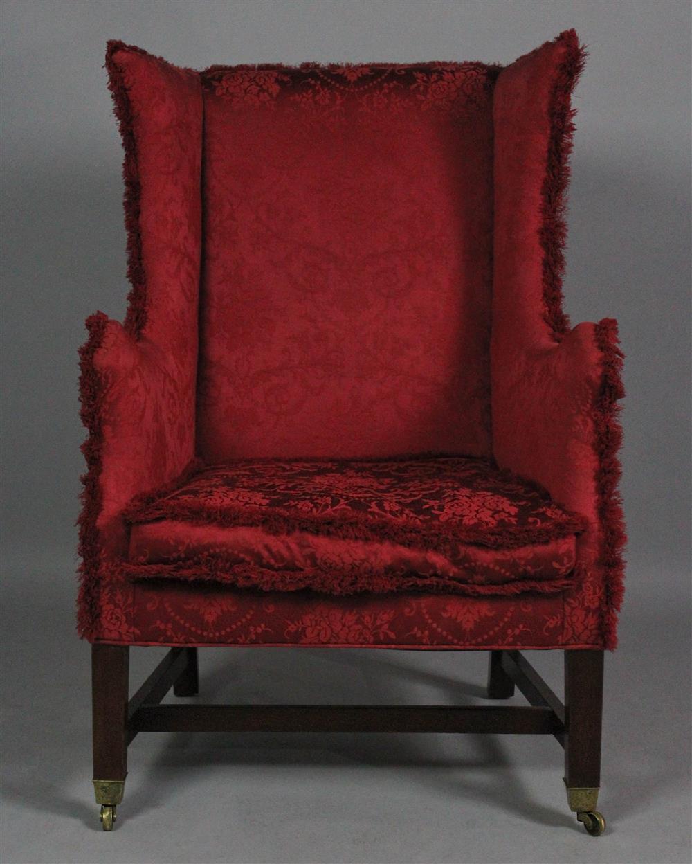 Appraisal: GEORGE III STYLE MAHOGANY DIMINUTIVE WING ARM CHAIR with loose