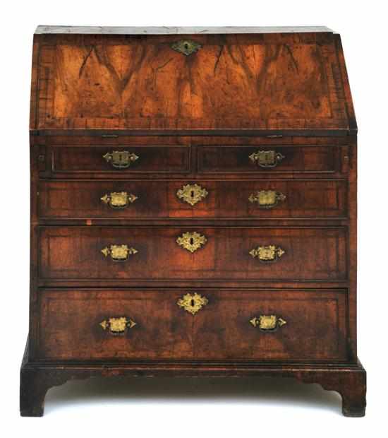 Appraisal: A George II burr walnut bureau The rectangular top above