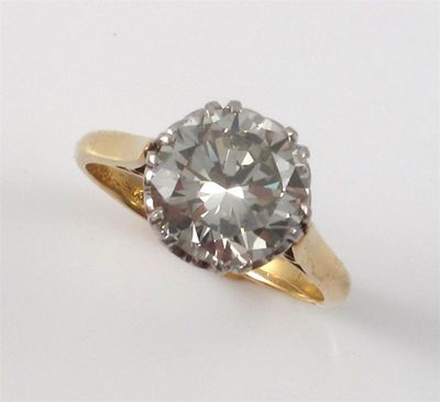 Appraisal: A diamond solitaire ring The round brilliant cut diamond weighs