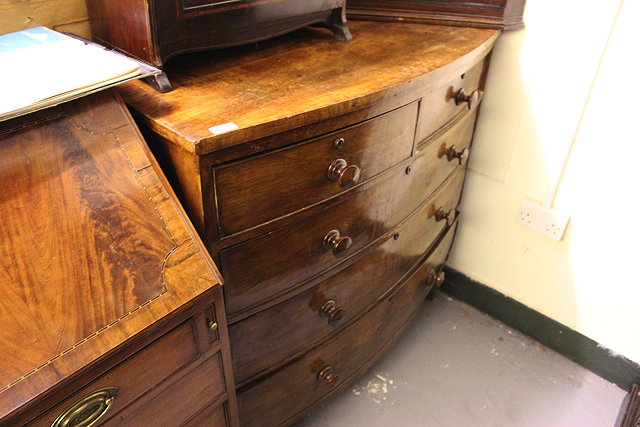 Appraisal: A VICTORIAN MAHOGANY BOW FRONTED CHEST of two short and