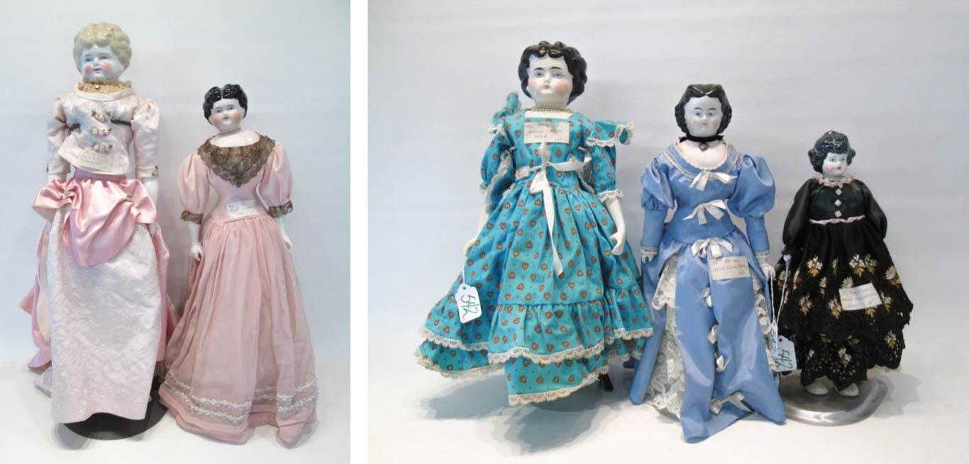 Appraisal: FIVE CHINA HEAD DOLLS with black molded hair and blond