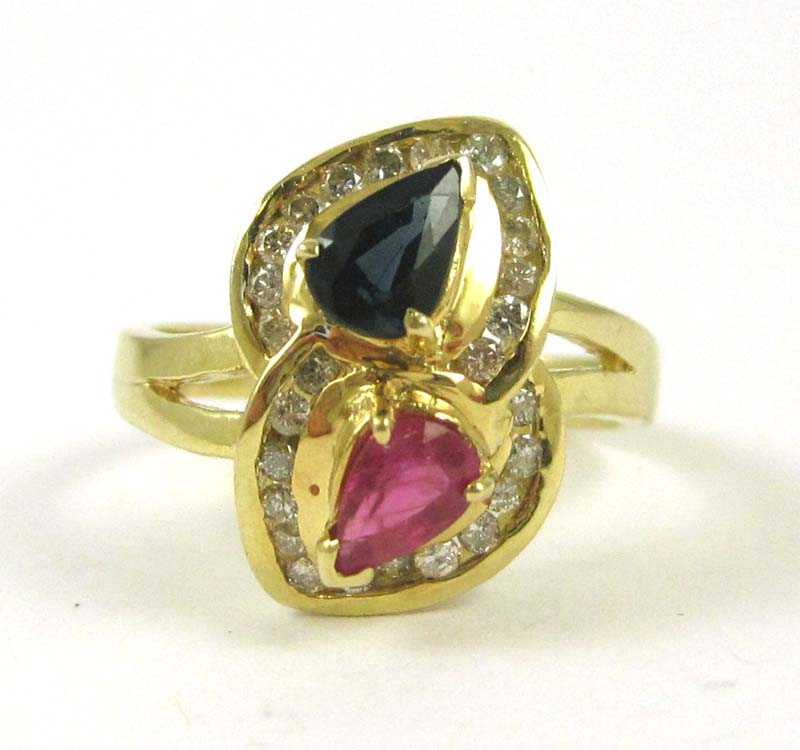 Appraisal: RUBY SAPPHIRE AND FOURTEEN KARAT GOLD RING with round-cut diamonds