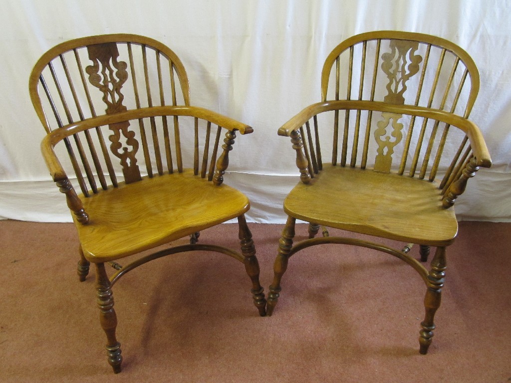 Appraisal: Two s elm Windsor armchairs raised on spindle supports cm