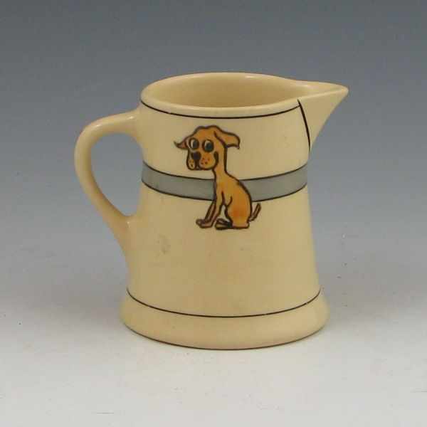 Appraisal: Roseville Juvenile dog pitcher Marked with Rv stamp Mint ''