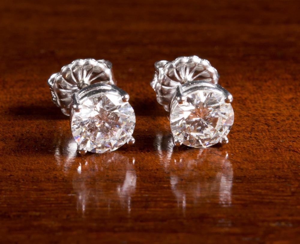 Appraisal: PAIR OF DIAMOND AND FOURTEEN KARAT WHITE GOLD EAR STUDS