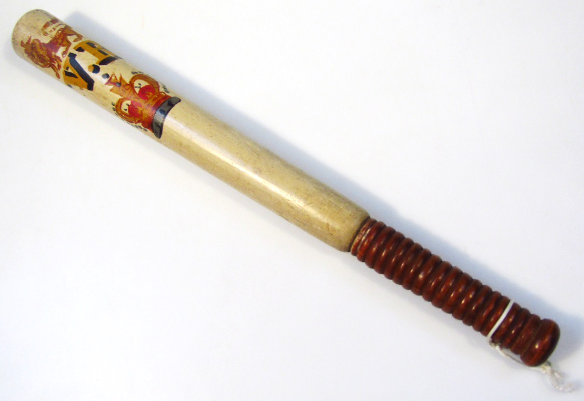 Appraisal: A Victorian wooden officer's truncheon of cylindrical outline with turned