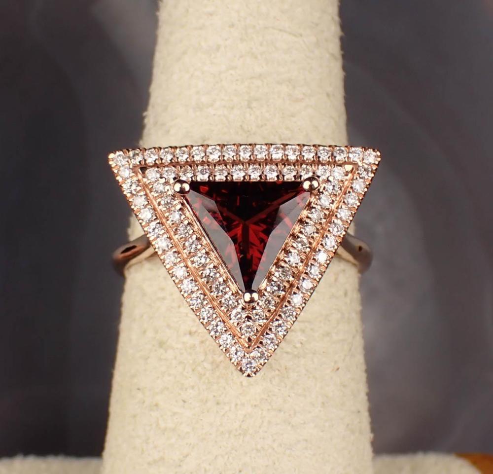 Appraisal: GARNET DIAMOND AND FOURTEEN KARAT GOLD RING The rose gold