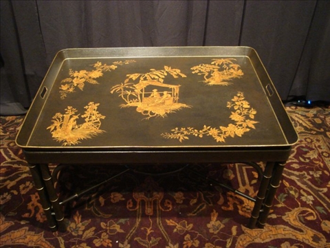 Appraisal: CHINOISERIE BLACK TOLE COFFEE TABLE Late th early st century