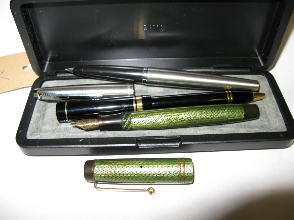 Appraisal: A Parker green lacquer fountain pen a Parker stainless steel