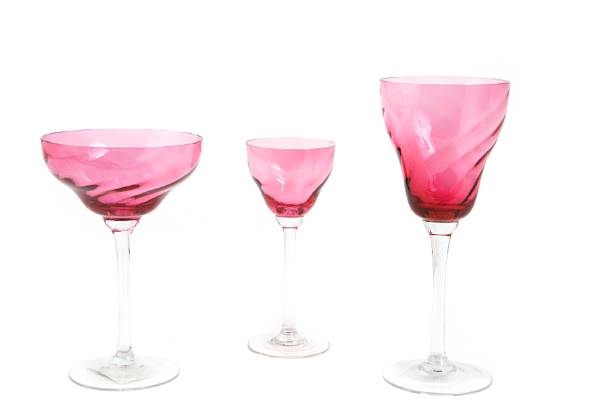 Appraisal: A group of swirled cranberry and clear glass stemware early