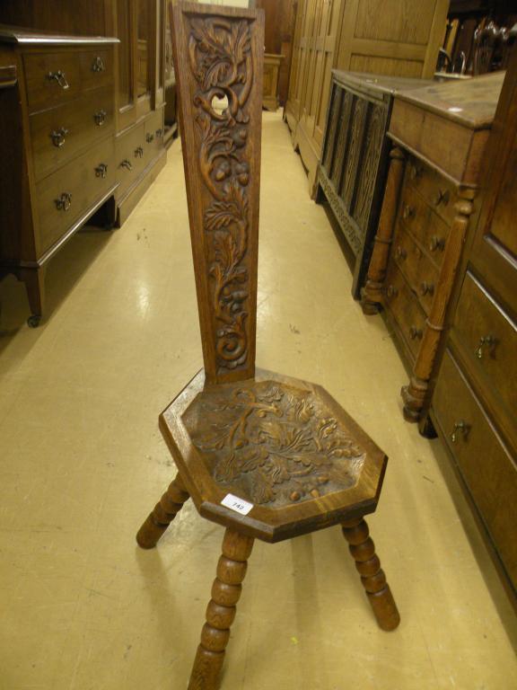 Appraisal: A carved oak marriage type chair on bobbin turned supports