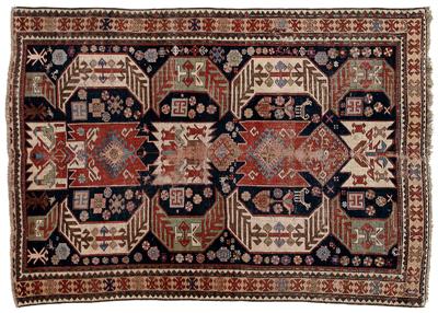 Appraisal: Kazak rug geometric and wing style central medallions flanked by