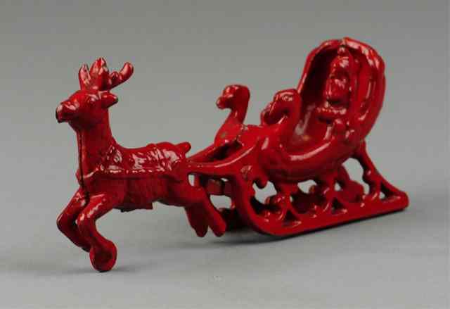 Appraisal: SANTA RIDING REINDEER DRAWN SLEIGH Very rare example cast iron