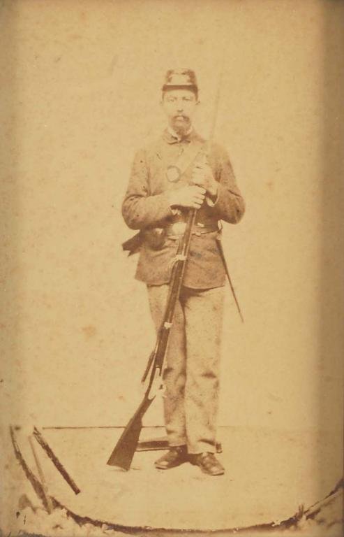 Appraisal: Walnut framed copy photograph of an African American soldier wearing