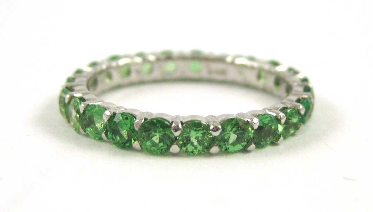 Appraisal: TSAVORITE AND FOURTEEN KARAT WHITE GOLD RING The white gold