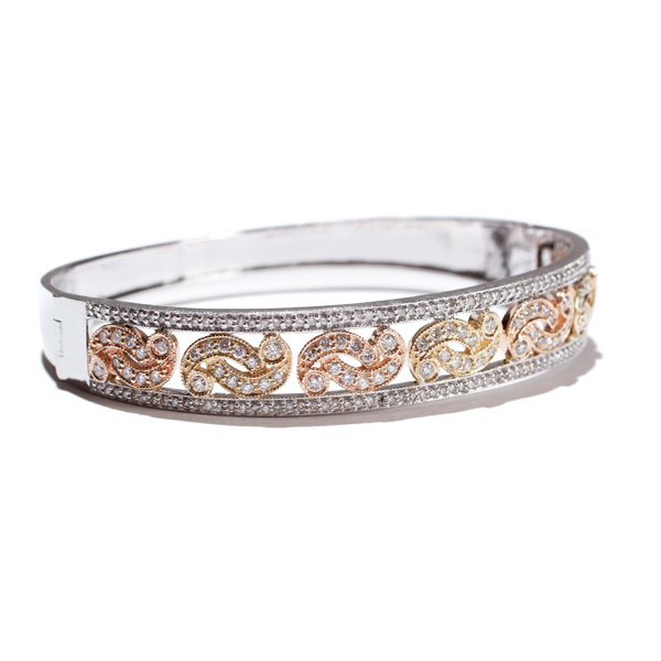 Appraisal: Ladies k three-tone gold scroll motif diamond bangle bracelet