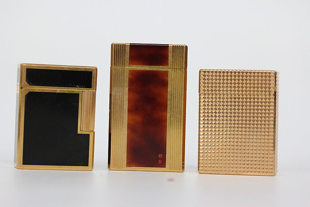 Appraisal: A GROUP OF THREE DUPONT OF PARIS GAS LIGHTERS one