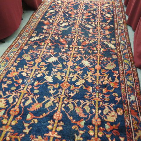 Appraisal: Mahal Persian Handmade Rug stylized florals primarily reds blues ivory