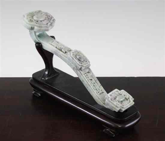 Appraisal: A Chinese jadeite ruyi sceptre the terminals carved in relief