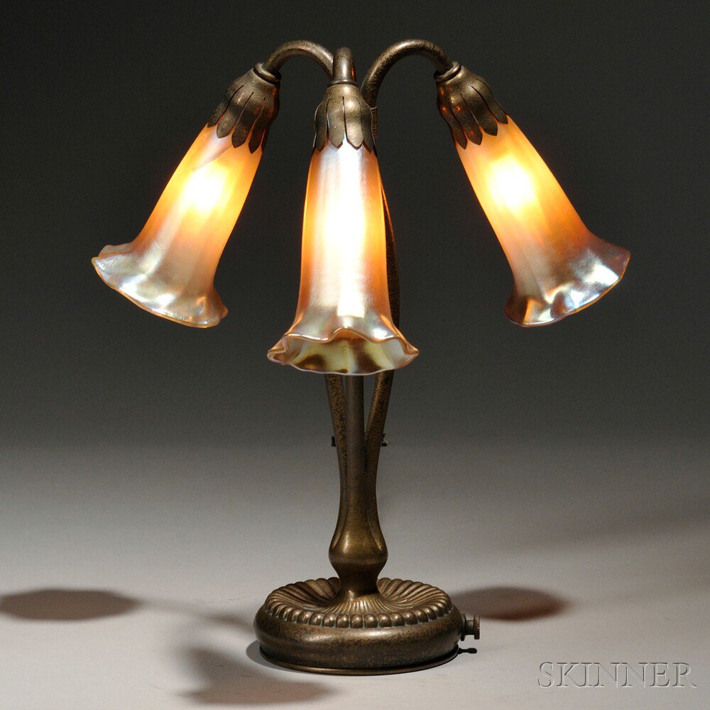 Appraisal: Tiffany Studios Three-light Lily Lamp Patinated bronze favrile glass New