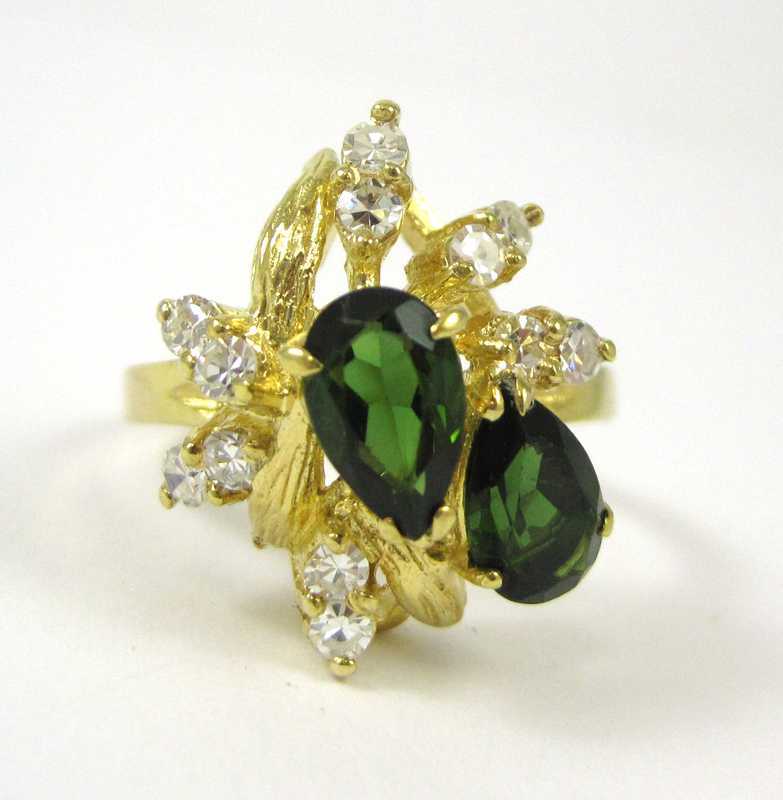 Appraisal: GREEN TOURMALINE AND FOURTEEN KARAT GOLD RING set with twelve