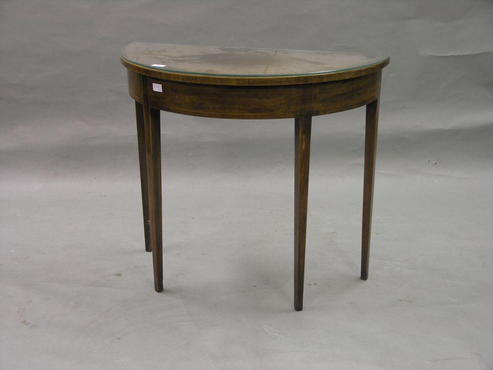 Appraisal: A th century inlaid mahogany side table half-round shape on